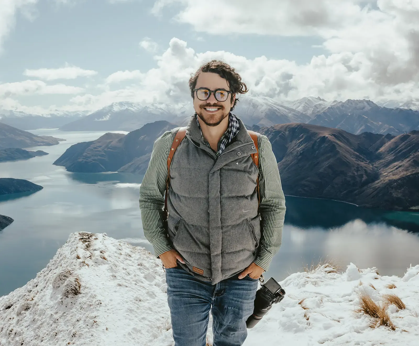 Cristian Batista, co-founder of Heli Elopements, on snowy Coromandel Peak above Lake Wanaka