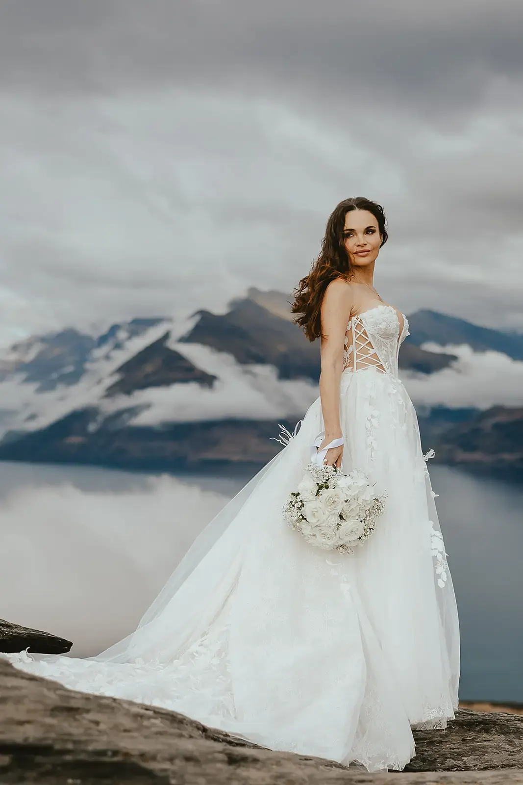 Bride portrait on the western ledge at Deer Park Heights above Lake Whakatipu