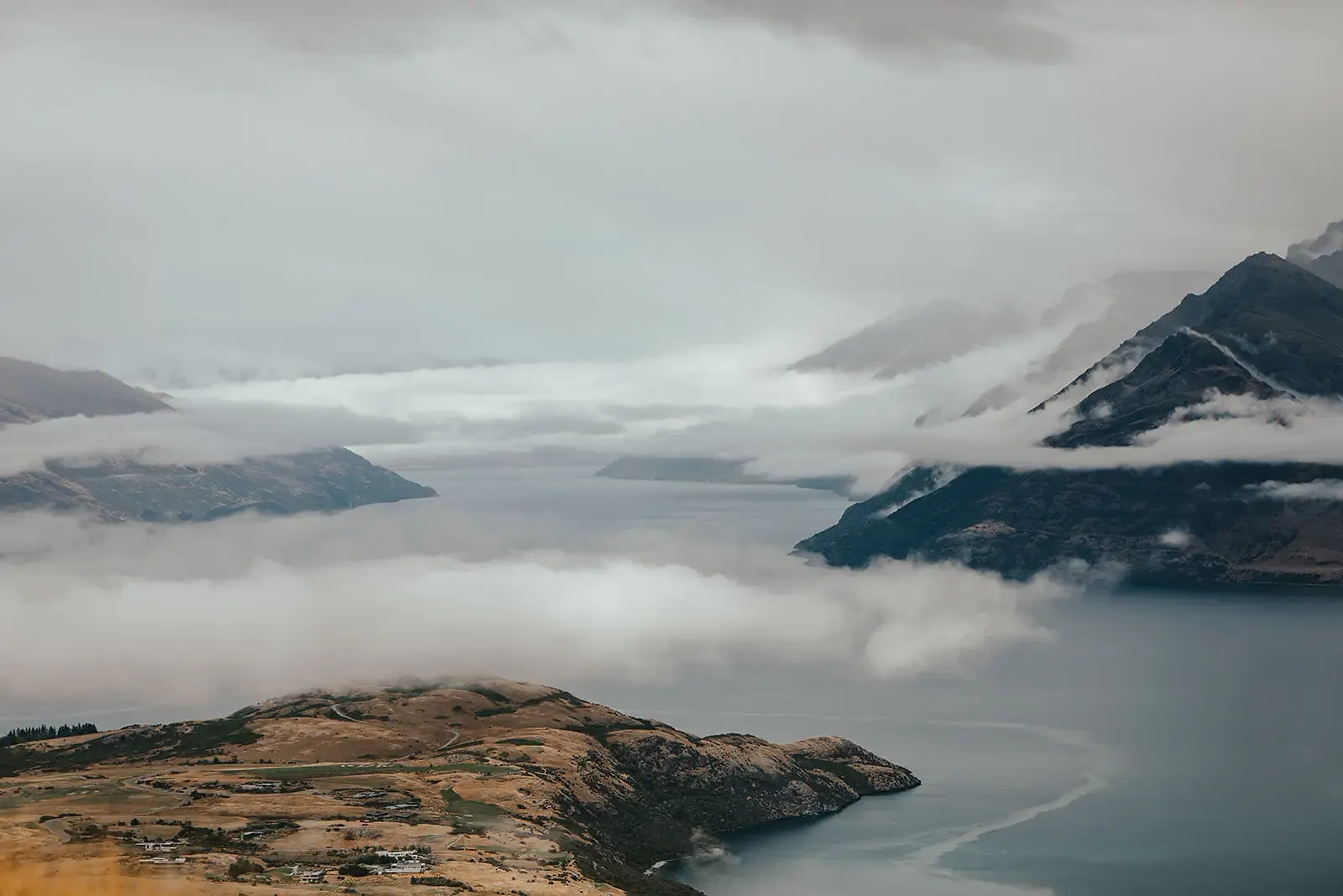 Kelvin Peninsula and Lake Whakatipu under low cloud from Deer Park Heights