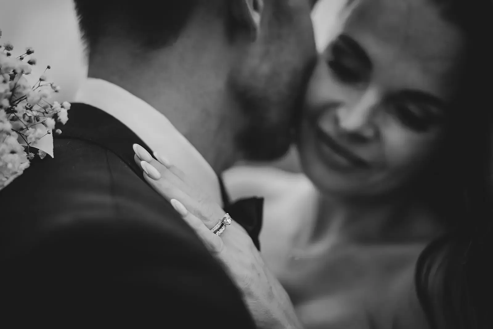 Black and white embrace showing both wedding rings at Deer Park Heights