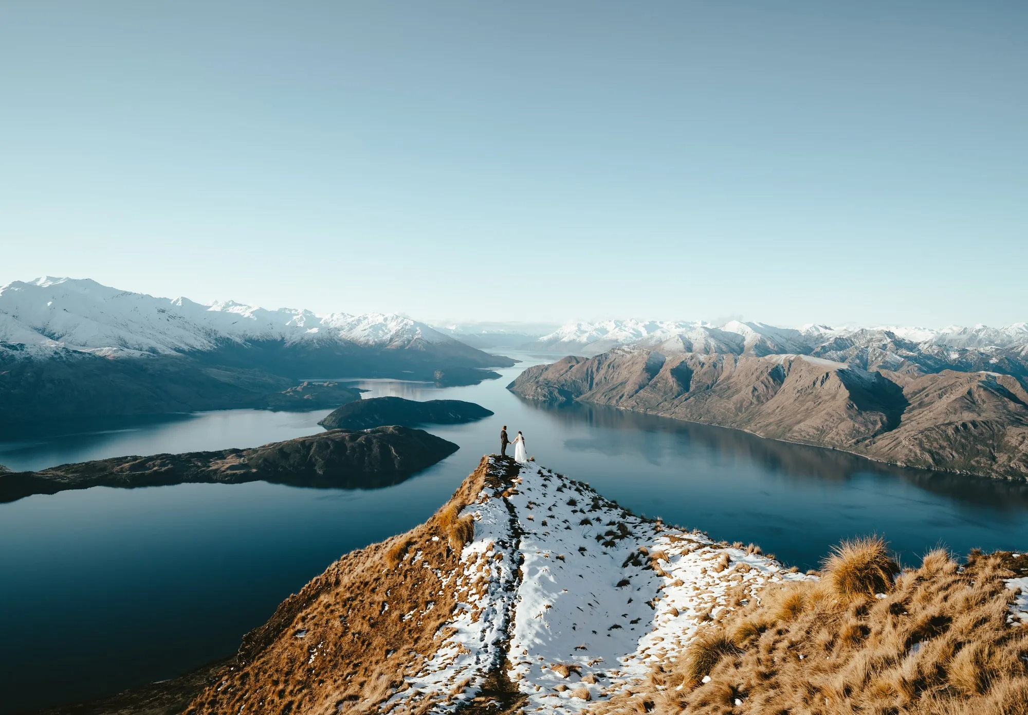 A helicopter on a remote alpine ridge in the Southern Alps.